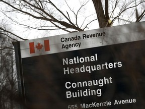 A Canada Revenue Agency sign outside the National Headquarters at the Connaught Building in Ottawa is seen on Monday, March 1, 2021. Getting an income tax refund can be a happy bonus for your household budget, but an unexpected tax bill can be an unpleasant surprise, especially if you don't have the cash on hand to pay the bill.
