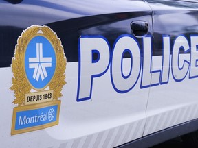 The Montreal police logo is seen on a police car in Montreal on Wednesday, July 8, 2020. Montreal police say several search and seizures are underway in connection with a homicide in the city's east end last month.