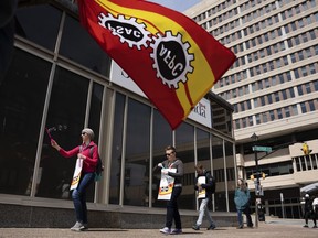 PSAC workers and supporters walk a picket line in Halifax on Monday, April 24, 2023.
