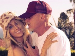 Tish Cyrus and Dominic Purcell are pictured in Cyrus' Instagram post announcing their engagement.
