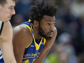 Warriors forward Andrew Wiggins waits for play to resume during the second half of the team's game against the Nuggets in Denver, Feb. 2, 2023.