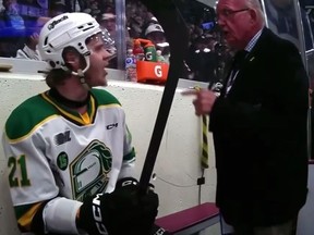 An off-ice Ontario Hockey League official argues with London Knights player Ryan Humphrey in the penalty box at the Peterborough Memorial Centre during Game 4 of the OHL finals on Wednesday May 17, 2023. (Screengrab/TSN)