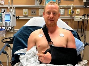 Kevin Miller in Lions Gate Hospital after he collided with a black bear on his bike Monday night.