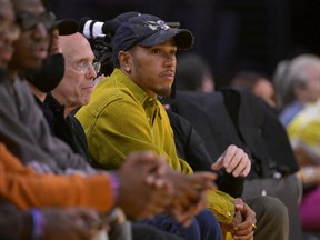 Formula 1 driver Lewis Hamilton attends a Los Angeles Lakers playoff game.