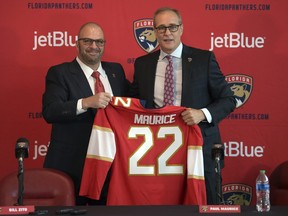 Paul Maurice, right, is introduced as the new head coach of the Florida Panthers by general manager Bill Zito in 2022.