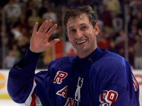 New York Rangers' Wayne Gretzky waves to the crowd during ceremonies following his last game in the NHL April 18, 1999.