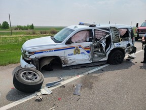 RCMP released photos of the damage caused when a semi trailer smashed into a Claresholm RCMP officer's vehicle. The officer sustained minor injuries. The incident happened on Friday, May 19, 2023.