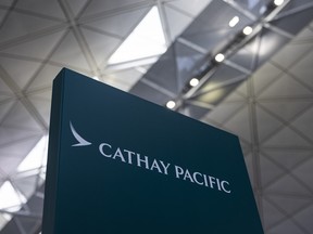 Signage for Cathay Pacific Airways at the departures hall of Hong Kong International Airport in Hong Kong, on March 8, 2023.