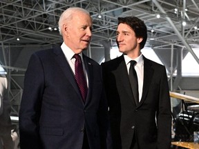 US President Joe Biden and Canada's Prime Minister Justin Trudeau arrive to attend a gala dinner at the Canadian Aviation and Space Museum in Ottawa, Canada, on March 24, 2023.