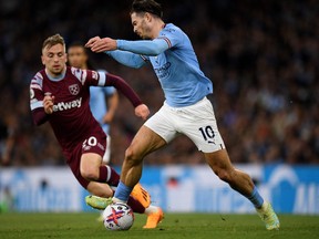 Manchester City's English midfielder Jack Grealish controls the ball during the English Premier League football match between Manchester City and West Ham at the Etihad Stadium in Manchester, north west England, on May 3, 2023.