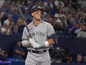 New York Yankees' Aaron Judge reacts after striking out against Toronto Blue Jays starting pitcher Kevin Gausman during a game in Toronto on Tuesday, May 16 2023.