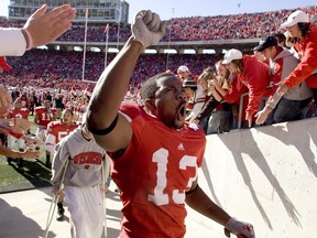 Wisconsin's Marcus Randle El celebrates on his way off the field after Wisconsin beat Indiana 33-3 in a college football game Saturday, Oct. 27, 2007, in Madison, Wis.