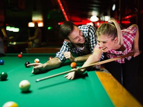 The behaviour of a pool player has alienated a couple from the other players.