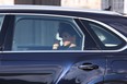 Prince Harry, Duke of Sussex and Meghan, Duchess of Sussex depart in a car after the procession for the Lying-in State of Queen Elizabeth II on September 14, 2022 in London, England. (Photo by Richard Heathcote/Getty Images)