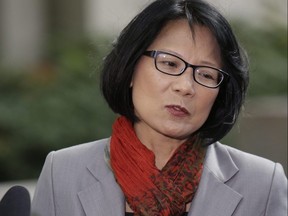 Then mayoral candidate Olivia Chow holds a press conference in front of 361 University Ave in Toronto, Oct. 7, 2014.