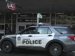 A Toronto Police cruiser and officers outside of Wellesley subway station on Jan. 26, 2023. That location is considered one of the "hotspots" in the city, according to a TTC official.