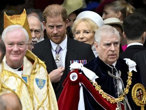 Prince Harry, Duke of Sussex, and Prince Andrew leave Westminster Abbey following the coronation ceremony of Britain's King Charles and Queen Camilla, in London, Saturday, May 6, 2023.