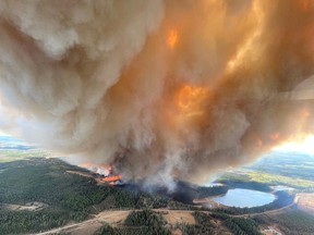 A smoke column rises from wildfire EWF031 near Lodgepole, Alberta, Canada May 4, 2023.