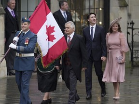 Canadian Prime Minister Justin Trudeau and Sophie Trudeau arrive at Westminster Abbey prior to the coronation ceremony of Britain's King Charles III in London Saturday, May 6, 2023.