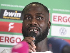 Marcus Coffie, player of the Teutonia Ottensen soccer club, speaks during a press conference in Hamburg, Germany, Thursday, Aug. 25, 2022. Hamburg-based Teutonia Ottensen says the North German Soccer Federation's decision to punish the club for breaking off a game in protest against alleged racist abuse directed at team captain Marcus Coffie is "a slap in the face."