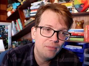 Hank Green is pictured in his vlog revealing his cancer diganosis.