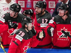 Canada's Samuel Blais, second from left, celebrates with teammates after scoring his side's second goal during the quarterfinal match between Canada and Finland at the ice hockey world championship in Tampere, Finland, Thursday, May 25, 2023.