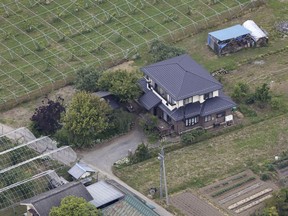 This shows a house where a man with a rifle and knife had holed up in Nakano, Nagano prefecture, central Japan Friday morning, May 26, 2023. Police said that they arrested the man armed with a rifle and a knife who had holed up inside the house for hours after allegedly killing four people, including two police officers. (Kyodo News via AP)