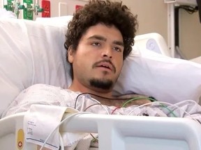 Jordan Rivera lying in hospital bed after losing arm in alligator attack.