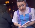 Man named Nick working at Disney wearing a fairy godmother's apprentice costume.