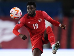 Canada midfielder Alphonso Davies (19) controls the ball against Honduras during first half CONCACAF Nations League soccer action.
