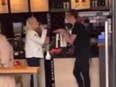 Transgender Starbucks manager, right, arguing with female customer.