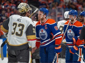 Connor McDavid (97) of the Edmonton Oilers, shakes hands with Adin Hill of the Las Vegas Golden Knights after game six of the second round of the NHL playoffs at Rogers Place in Edmonton on May 14, 2023. The Golden Knights advanced in the playoffs after taking the series four games to two.