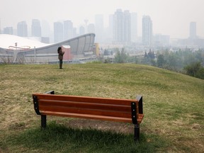 Thick smoke from wildfires blankets the downtown in Calgary on Wednesday, May 17, 2023.