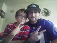 Chris Wright, right, and eldest son giving peace signs.