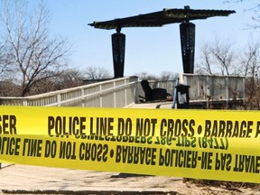 An outlook on the Red River on Waterfront Drive at George Avenue, including an armchair, is taped off in Winnipeg on Mon., April 17, 2023. Human remains were found nearby. KEVIN KING/Winnipeg Sun