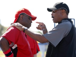 Former Toronto Blue Jays manager Cito Gaston (right) talks with Cincinnati Reds manager Dusty Baker.