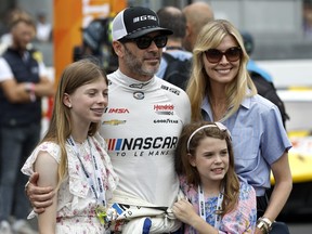 Jimmie Johnson of the NASCAR Next Gen Chevrolet ZL1 looks on with his family during the 100th anniversary of the 24 Hours of Le Mans.