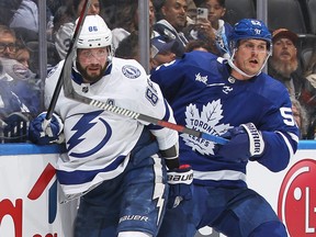 Maple Leafs’ Noel Acciari (right), here getting physical with Tampa Bay’s Nikita Kucherov, is the kind of rugged winger that new GM Brad Treliving favours. Only problem is that Acciari is a free agent and will have to be re-signed by Treliving, if he is to return to the Leafs next season.