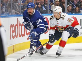 Maple Leafs centre Auston Matthews, left, fights off Gustav Forsling of the Florida Panthers during Game 2 of their second round playoff series at Scotiabank Arena on May 4, 2023, in Toronto. Working on a new deal for Matthews tops the to-do list for the Buds in the coming weeks.