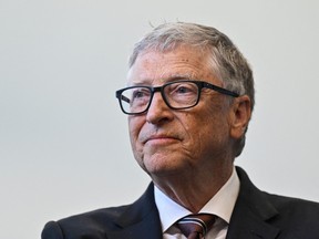 Microsoft founder Bill Gates reacts during a visit with Britain's Prime Minister Rishi Sunak of the Imperial College University, in central London, on February 15, 2023.