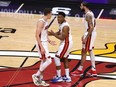 Heat players Duncan Robinson, left, and Kyle Lowry, centre, react during fourth quarter action against the Nuggets in Game Four of the 2023 NBA Finals at Kaseya Center in Miami, Friday, June 9, 2023.