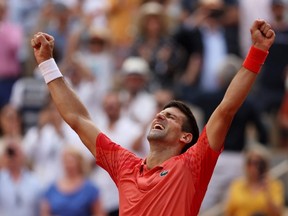 Novak Djokovic celebrates winning match point against Casper Ruud in the men's final at the 2023 French Open at Roland Garros in Paris, Sunday, June 11, 2023.