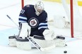 Jets goalie Connor Hellebuyck. Winnipeg Jets' sugarcoating their intentions — retooling rather than rebuilding — hasn't swayed the minds of Pierre-Luc Dubois or Hellebuyck.