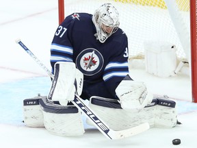 Jets goalie Connor Hellebuyck. Winnipeg Jets' sugarcoating their intentions — retooling rather than rebuilding — hasn't swayed the minds of Pierre-Luc Dubois or Hellebuyck.