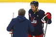 Blake Wheeler in conversation with head coach Rick Bowness during Winnipeg Jets practice on Monday Feb. 27, 2023.