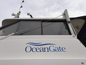 The logo for OceanGate Expeditions is seen on a boat parked near the offices of the company at a marine industrial warehouse office door in Everett, Wash., on Thursday, June 20, 2023.