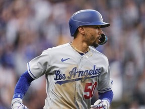 Los Angeles Dodgers' Mookie Betts runs the bases on a three-run home run against the Colorado Rockies during the fourth inning of a baseball game Wednesday, June 28, 2023, in Denver.