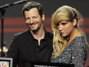 Songwriter Lukasz "Dr. Luke" Gottwalk, left, poses with singer Kesha after receiving his award at the 28th Annual ASCAP Pop Music Awards in Los Angeles, April 27, 2011.