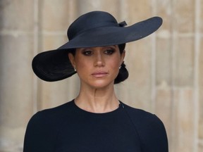Meghan Markle leaves Westminster Abbey after the funeral of Queen Elizabeth II.
