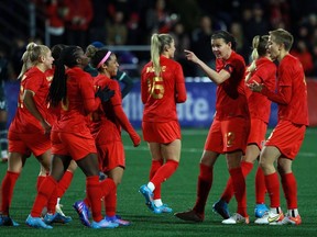 The Canadian women have dropped one place to No. 7 in the latest FIFA world rankings, overtaken by Spain in the leadup to next month's Women's World Cup. Canada's Christine Sinclair points to teammates after scoring a goal in Langford, B.C., Monday, April 11, 2022.